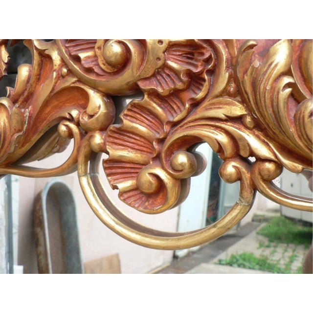 Beautiful mirror 1950, Louis XV Rococo style. red patina and original gilding.