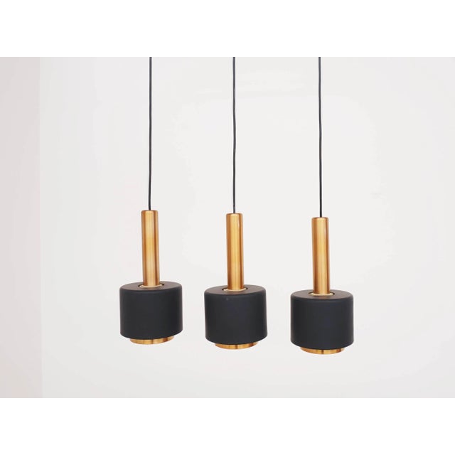 Copper Pendant Lamp with Row of 3 Cones from Doria Leuchten, Germany, 1960s, in Very Good conditions. Designed 1960 to...