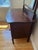 Elevate your bedroom or dressing area with this classic two-piece antique Victorian-style vanity chest and mirror set....