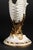 A fanciful antique porcelain vase from Royal Worcester, modeled as a large ribbed nautilus shell perched atop a gilt...