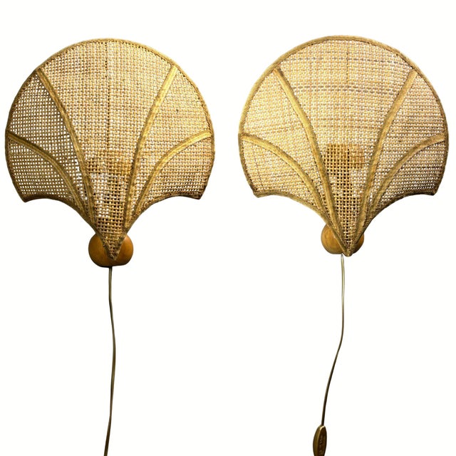 Pair of italian rattan scallop wall sconces, pine and brass, 1970s each shade is a fan-shaped scallop of woven rattan...