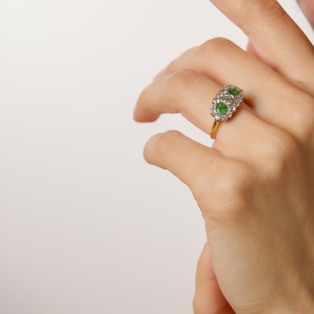 A refined jewel of the Edwardian era, this exquisite ring showcases a luminous arrangement of seventeen old European and...