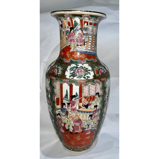 A very nice tall ornate ceramic vase / jug from China. Beautiful figural and floral designs. Very colorful.