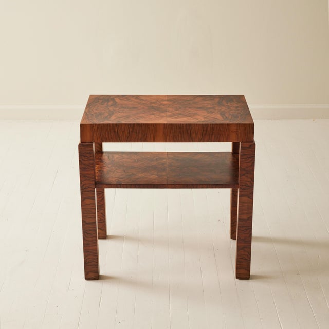 Art Deco side table, circa 1930s, showcasing a striking book-matched burl walnut veneer with a dramatic, symmetrical grain...