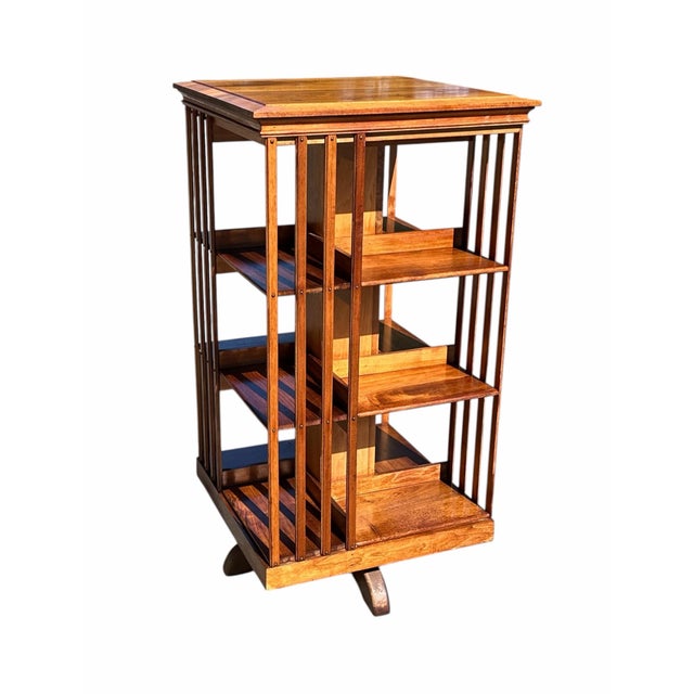 With our highest compliments Bay Colony Antiques proudly offers this wonderful antique revolving bookcase. Any home with a...