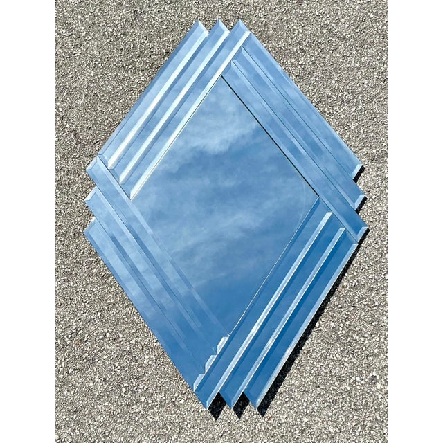 This striking 1980s beveled mirror is a masterclass in Postmodern geometric design. Taking cues from the Art Deco revival...