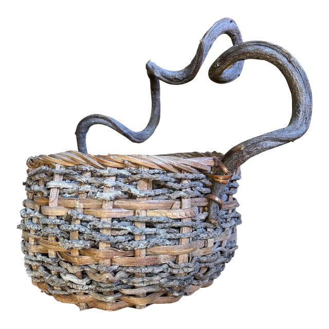Early 20th Century Vintage Basket with Twisted Vine Handle For Sale