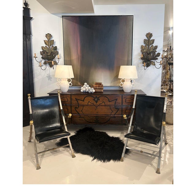This stylish pair of folding chairs by Maison Jansen showcases the sophisticated lines and refined craftsmanship for which...