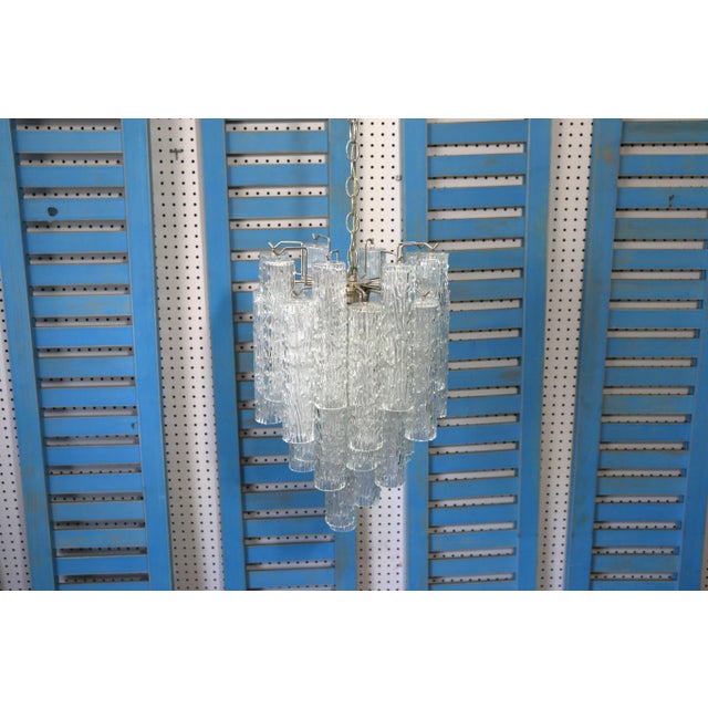 Elegant Mid-Century Tronchi chandelier made in Italy, designed by Toni Zuccheri for Venini, in the 1960’s. Featuring 28...