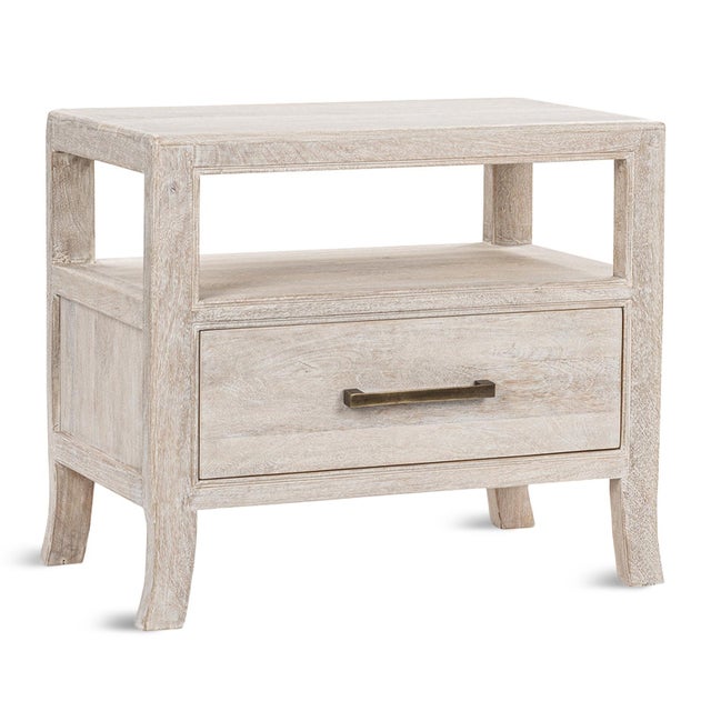 Fresh and modern white wash mango wood crafted night stand with one drawer and open shelving area above. Antiqued brass...