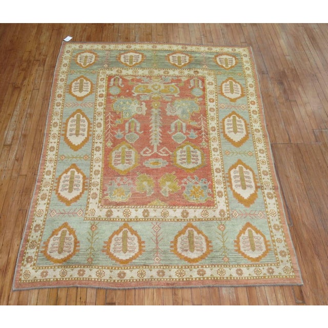 An absolutely phenomenal antique Turkish Oushak in predominant shades of orange and green, circa 1920. Measures: 6'4'' x...