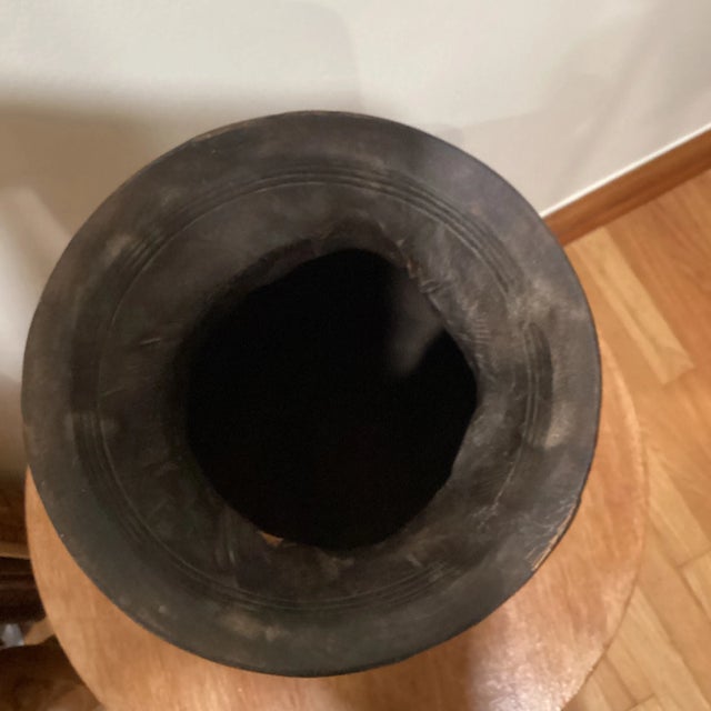 Vintage carved wooden pots were used to store milk and other dairy products in India before refrigeration was available