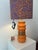 Orange lamp vase made from a vintage Alfred Klein vase from the 1960s Base: Table lamp constructed from a ceramic vase by...