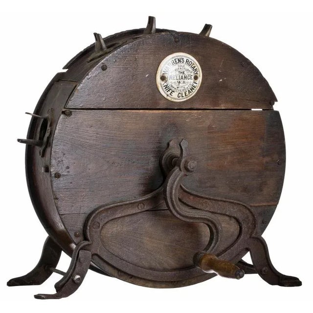 A rare knife sharpener from the late 18th century. English, iron and wood, by "Warren's Rotary." Minor defects....