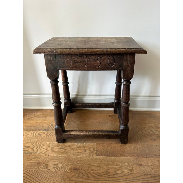 18th century English oak stool. “1750” carved on apron as well as “17”, “MM”, and “HM”. Beautiful patina. 17 7/8” x 10...