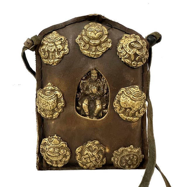 Ghau is a small prayer box/bag worn as pendant by Buddhists as portable shrines which can be pray by prayer during their...