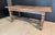 A solid Oak Farmhouse Dining Table having loads of character to the wood and a rare 2 plank top. Turned leg supports and...