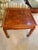 Mid-century solid wood side table. Features a classic horseshoe / horse-hoof feet and clean, traditional Ming-style...