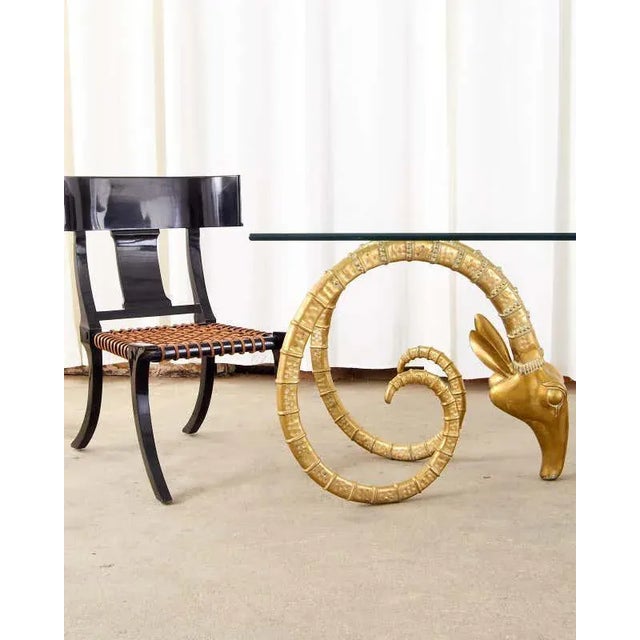 Fantastic pair of large klismos chairs featuring a dramatic ebonized black lacquer finish and leather woven rope strap...