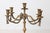 This vintage five-arm candelabra features an elegant ornate silhouette with draped rope and tassel detailing and a soft...