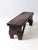 This antique farmhouse bench features a dark, aged finish with a rich patina that reflects years of use. Angled supports...