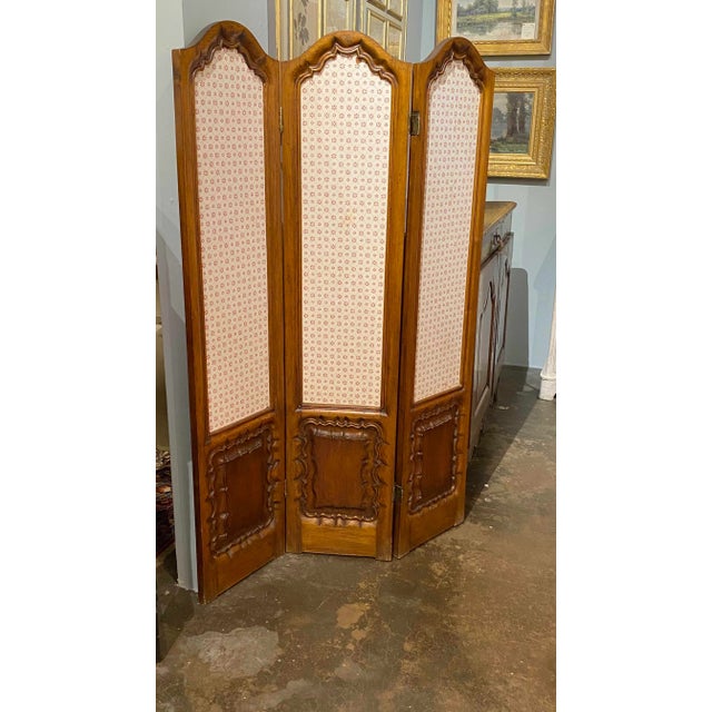 A 19th century three panel Walnut folding screen from France.