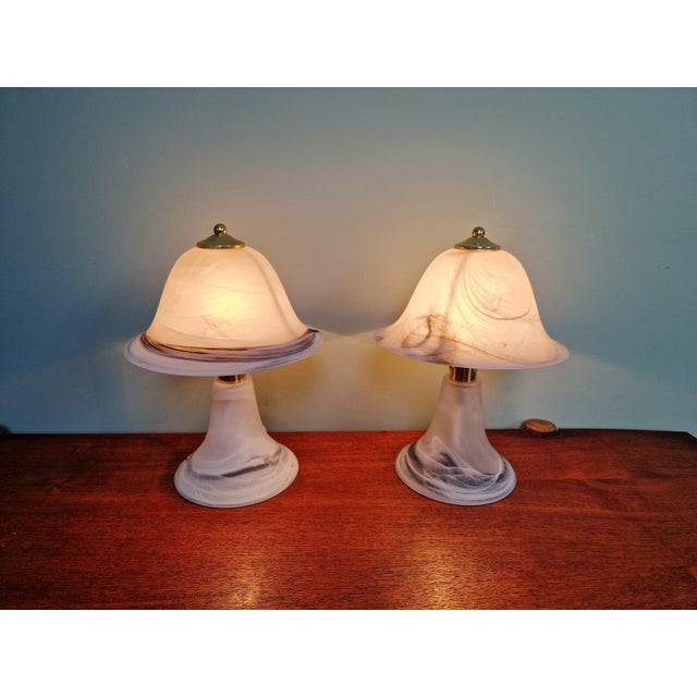 Pair of mushroom lamps in marbled Murano glass with brass finials. These lamps were produced in Italy in the 1970s-80s....