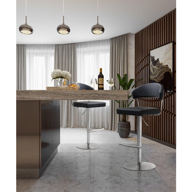 Furnish your kitchen or bar area in contemporary style with the Cosmo stool from TOV. The solid stainless steel frame...