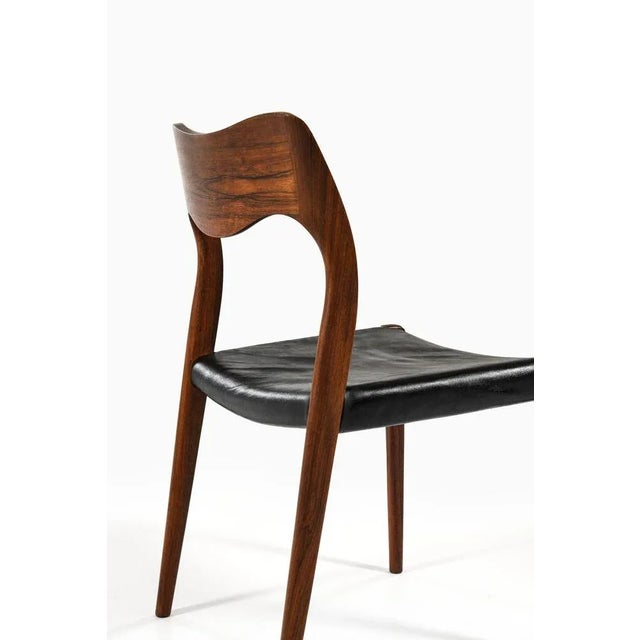 Set of 6 dining chairs in rosewood and original black leather by niels o. Møller, 1951 material: rosewood and original...