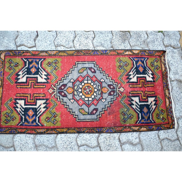 This is a vintage Turkish Oushak rug from the 1960s. The piece was hand-knotted.