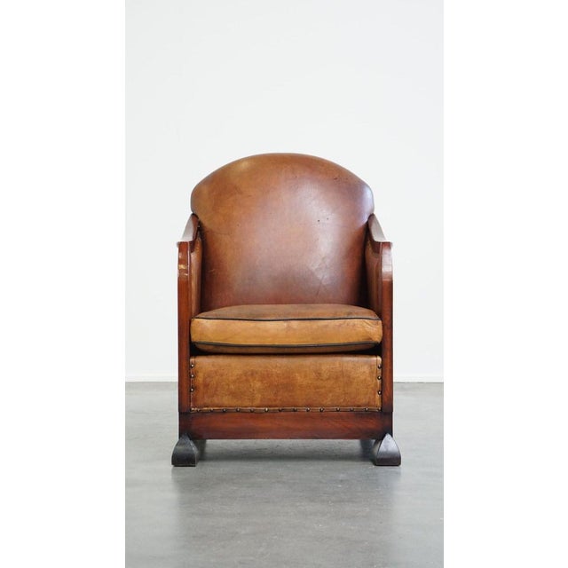 This unique, stately, comfortable sheep leather Art Deco design armchair. This eye-catcher has a unique, stately...