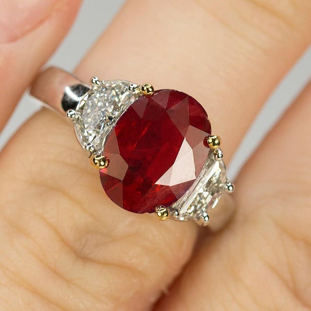 Platinum & 18k Ring with one 3.09 carat AGL certified ruby and 2 half moon diamonds weighing 0.78 carats. 7.90 grams.