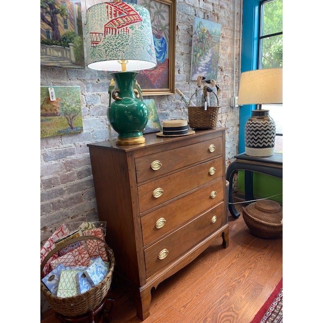 A handcrafted walnut chest from early North Carolina, showcasing the refined joinery and warm patina characteristic of...