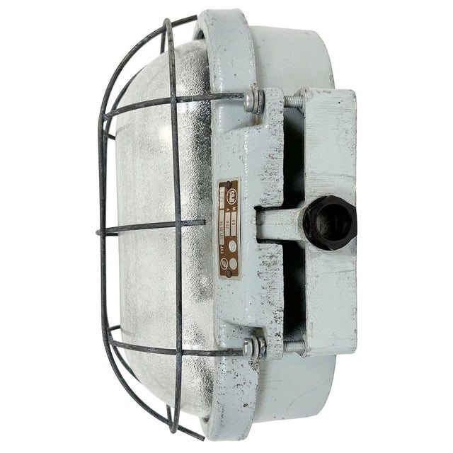 This industrial wall light was made by Elektrosvit in former Czechoslovakia during the 1970s. It features a cast aluminium...