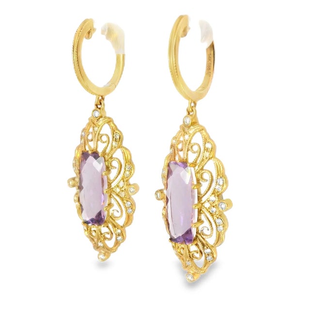 14K pink rose gold drop earrings featuring a large natural amethyst accented with 56 brilliant round diamonds totaling...