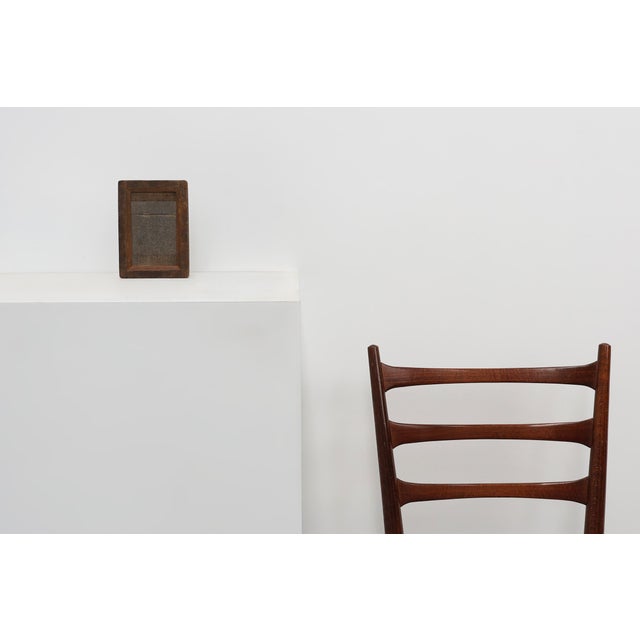 A small rustic French photo frame from the early 20th century, crafted in solid wood with a deep rebate and glazed front....