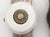 Antique door knob set with a white porcelain door knob and a nickel plated brass keyhole back plate. Made by Gilbert Lock...