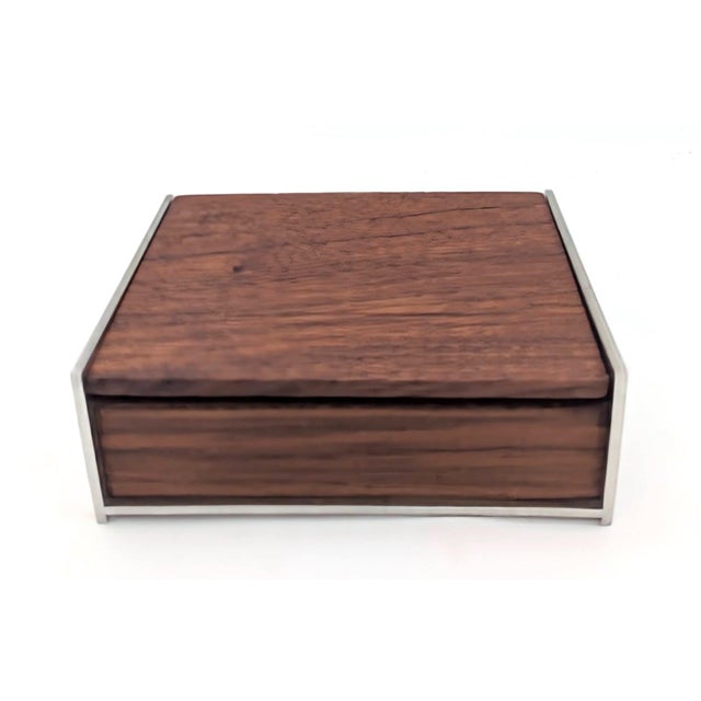 Offered is a mid 20th Century, circa. 1960s, Danish Modern style cigarette box made of Walnut wood and brushed aluminum....