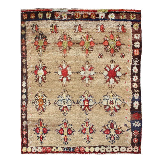 Early 20th Century Angora Turkish Tulu Carpet With Colorful Floral Designs Set on Sand Field For Sale
