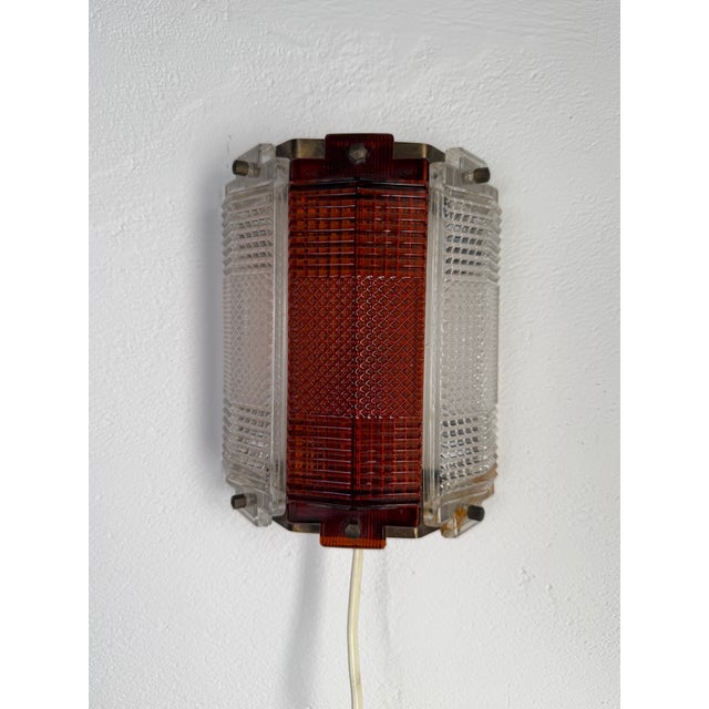 Original wall lamp designed by Wiktor Berndt, chief designer at the renowned Swedish glassworks Flygsfors Glasbruk. The...