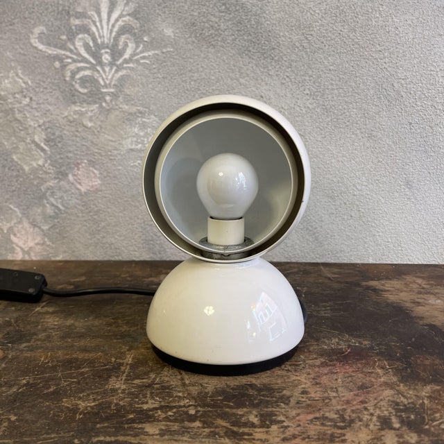 This eclisse table lamp, designed by vico magistretti and produced by artemide in 1965, represents a significant piece of...
