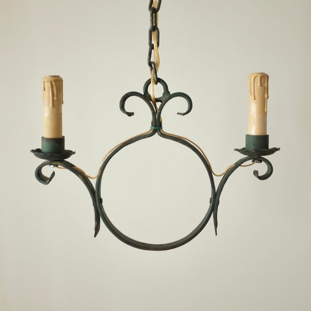 Two Arm Swedish Modern Pendant with organic details circa 1940/50s. Wrought iron in a dark green shade with two individual...