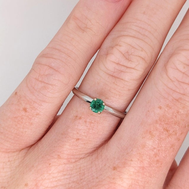 An emerald rests in a rich green at the center of this solid 14K white gold ring. Emerald has been treasured since...