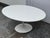 Design Plus Gallery presents an Italian Saarinen Style Coffee Table from Alivar. This oval coffee table showcases a white...