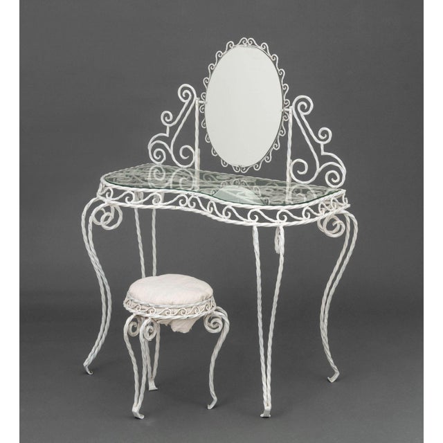 Modern White Painted Wrought Iron Serpentine Vanity Table and Stool, with oval mirror above glass top and scroll work...