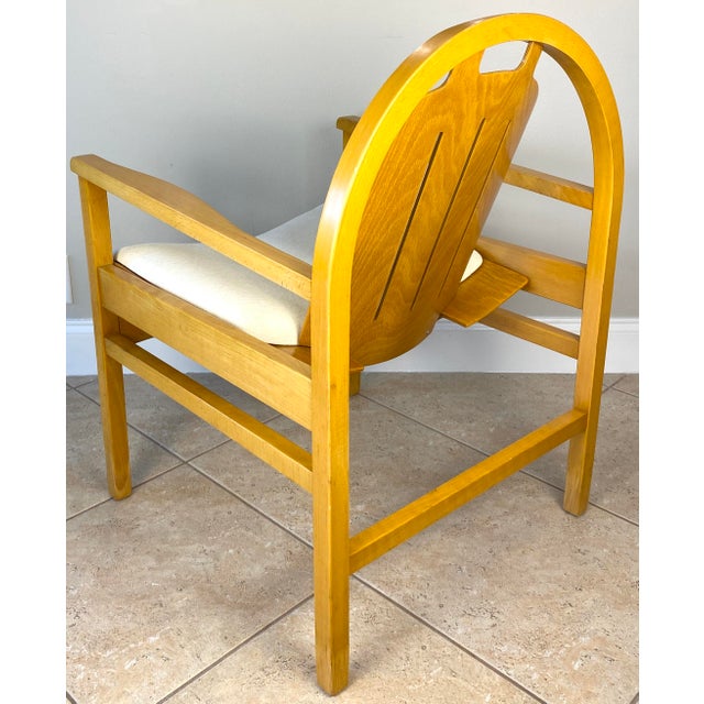 A fine, newly upholstered Pair of Baumann Argos Armchairs made of Beechwood, with Creme Color Fabric circa 1970. These...