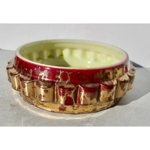 Beautiful Sevres Manufacture Nouvelle Faience circa 30s' bright red and gold in a lustre glaze. An Art Deco low bowl with...