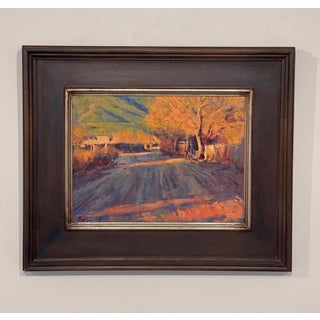 Late Afternoon Taos Pueblo by Lorenzo Chavez | Oil Painting of a sunlit road in Taos Pueblo For Sale