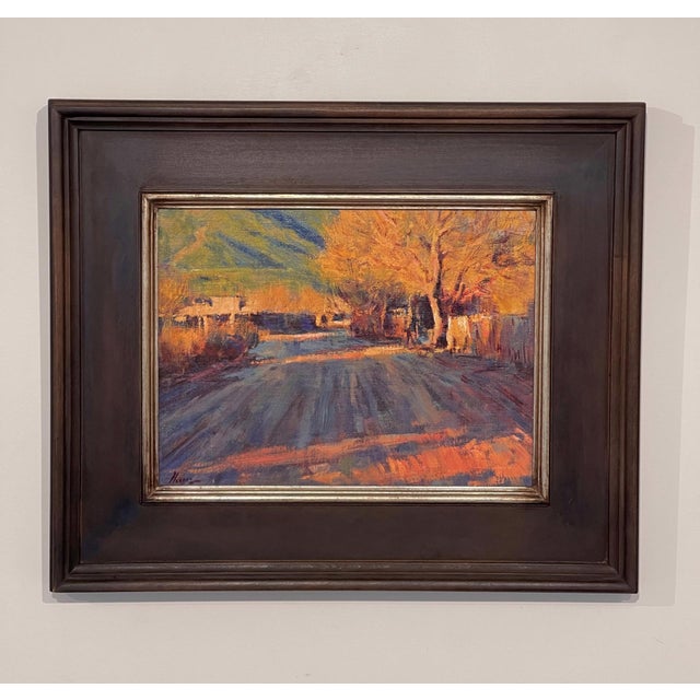 Late Afternoon Taos Pueblo by Lorenzo Chavez | Oil Painting of a sunlit road in Taos Pueblo For Sale