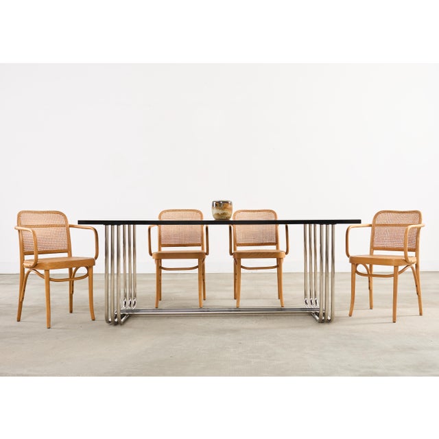 A refined set of four Thonet bentwood labeled and stamped armchairs designed by Josef Hoffman, known as the "Model 811...